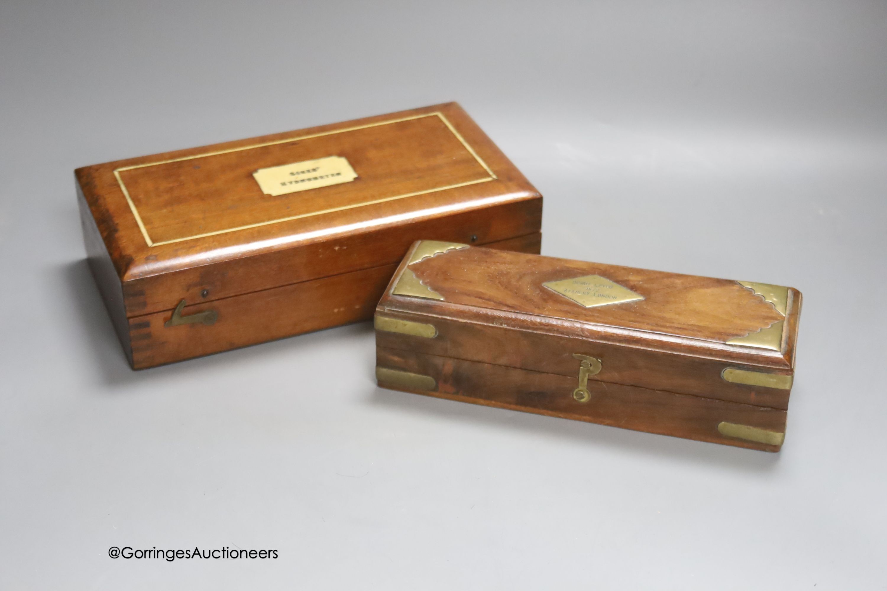 A Stanley, London spirit level, 1872 (cased) and a Sykes Hydrometer (cased)